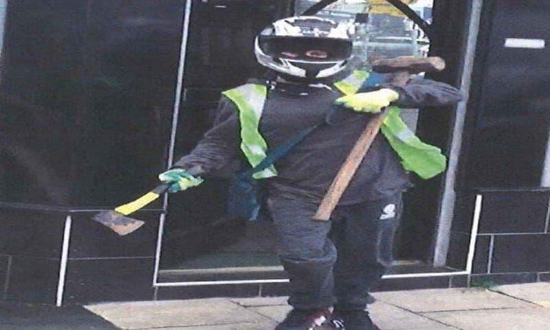 Bystander catches armed raiders on camera